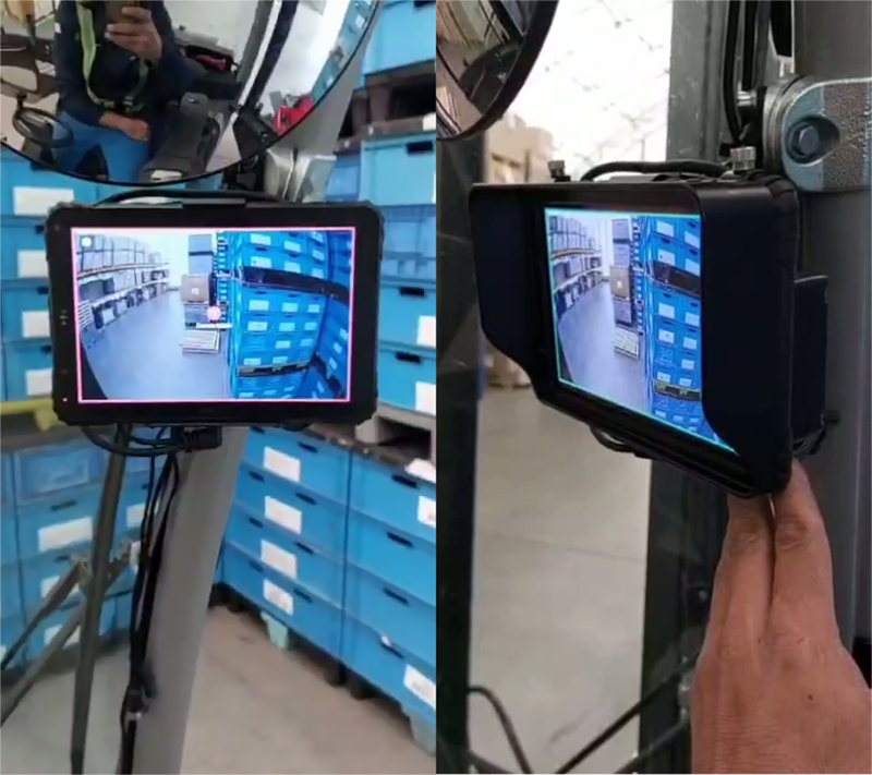 Rugged tablet with locking vehicle docking station mounted on forklift ROPS cage via short RAM arm — operator eye-level installation for warehouse inventory management and WMS access with unobstructed forward visibility