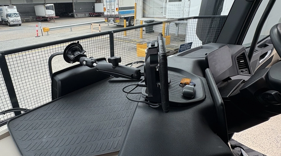 Slim 17mm rugged vehicle tablet mounted close to dashboard surface with minimal A-pillar blind spot compared to thick 28mm tablet protruding into driver's forward field of view
