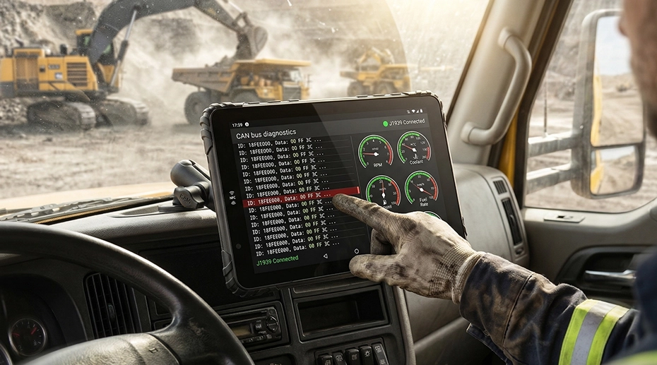 Driver transferring rugged tablet from snowplough to street sweeper using quick-release dock, demonstrating one-tablet-multiple-vehicle fleet hardware architecture